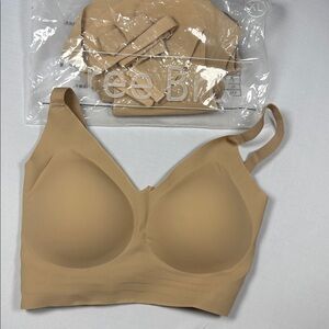 Two seamless tan bras